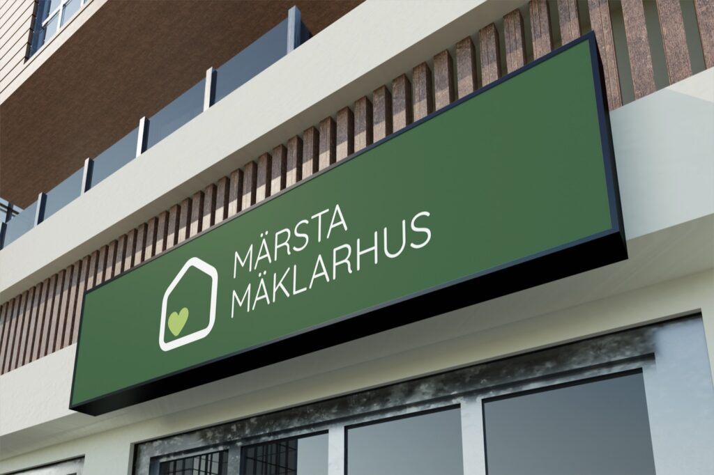Fasadskylt med Märsta Mäklarhus logotyp
